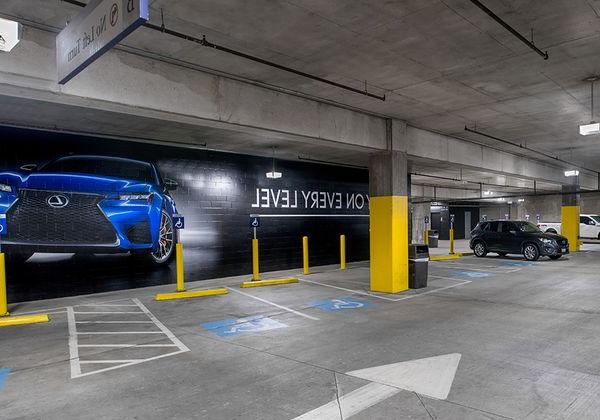 American Airlines Center parking structure in Dallas, TX with bright, high quality lighting from parking garage LED light fixtures in the handicap section.